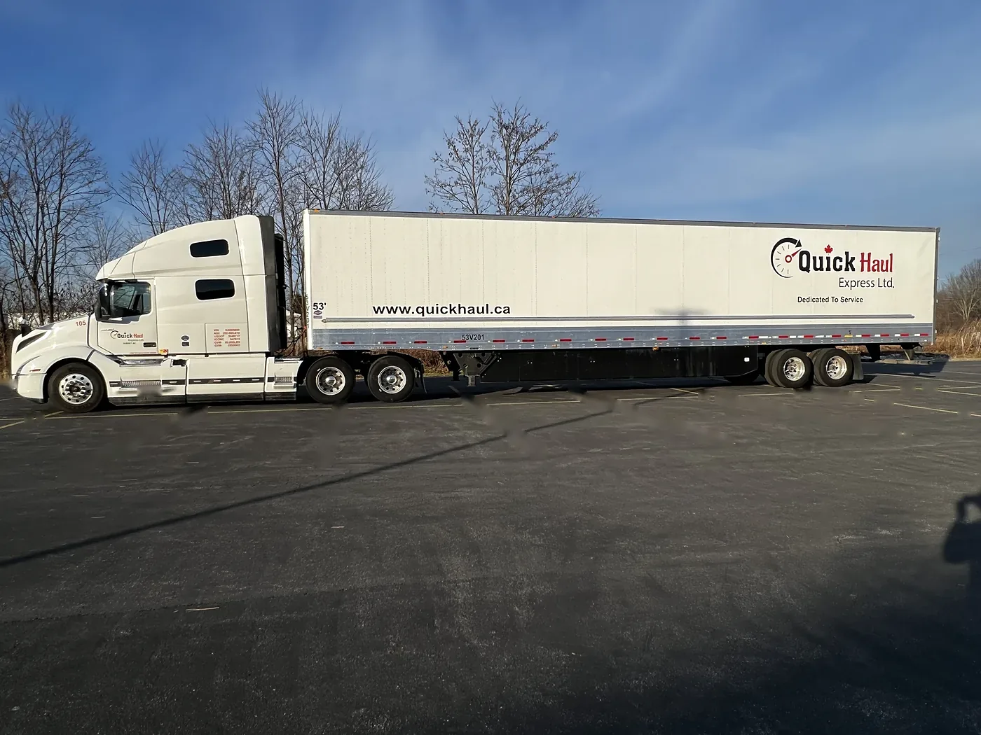 Quick Haul Volvo VNL and 53-foot dry van trailer, side view